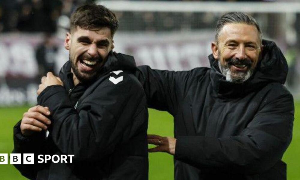 Claudio Braga and Derek McInnes celebrate Hearts' win