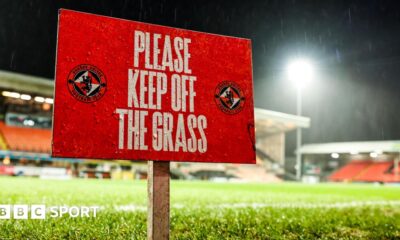 Sign reading 'Keep off the grass' before a Scottish Premiership match at Tannadice