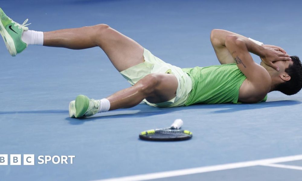 Carlos Alcaraz falls to the floor after beating Alexander Zverev
