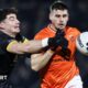 Armagh's Greg McCabe is challenged by James Guinness