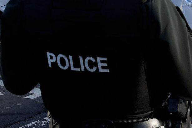 Man arrested after breaking windows and putting shop worker in headlock