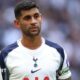 Cristian Romero wearing a white Tottenham matchday shirt