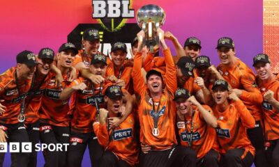 Perth Scorchers players celebrate as they lift the 2025-26 Big Bash League trophy following victory over Sydney Sixers