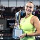 Aryna Sabalenka holds the trophy after winning the Brisbane International