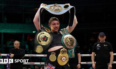 Lauren Price poses with her world titles after beating Natasha Jonas