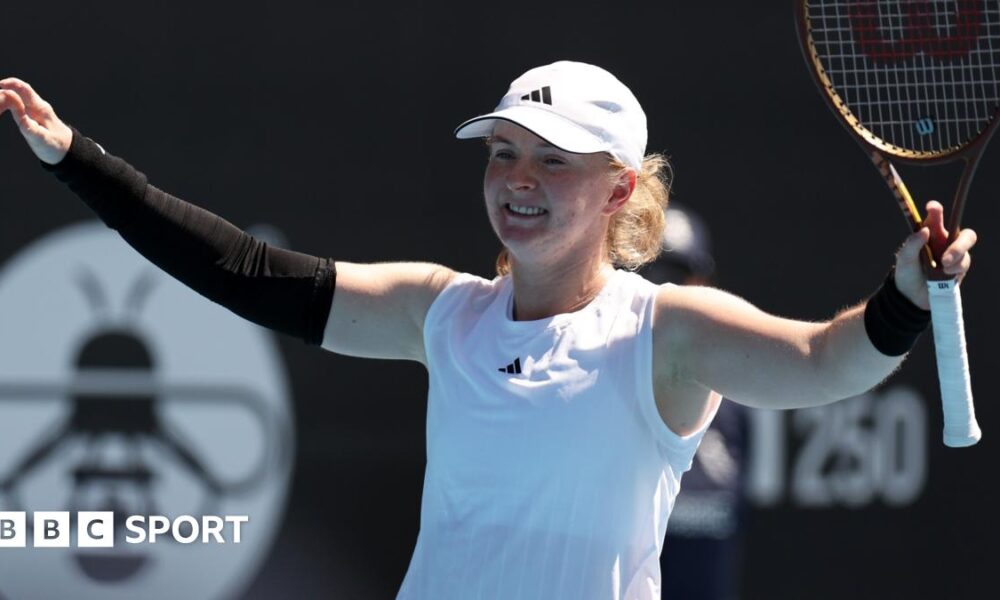 Francesca Jones raises her arms in celebration after victory at the Auckland Classic