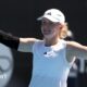 Francesca Jones raises her arms in celebration after victory at the Auckland Classic