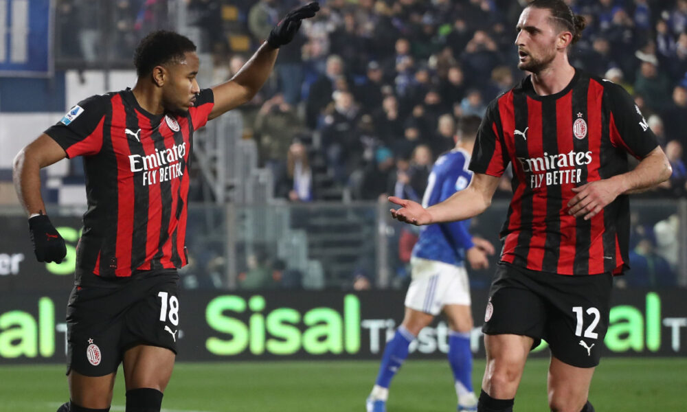 COMO, ITALY - JANUARY 15: Christopher Nkunku of AC Milan celebrates with his team-mate Adrien Rabiot after scoring their team's first goal1 from the penalty spot during the Serie A match between Como 1907 and AC Milan at Giuseppe Sinigaglia Stadium on January 15, 2026 in Como, Italy. (Photo by Marco Luzzani/Getty Images)