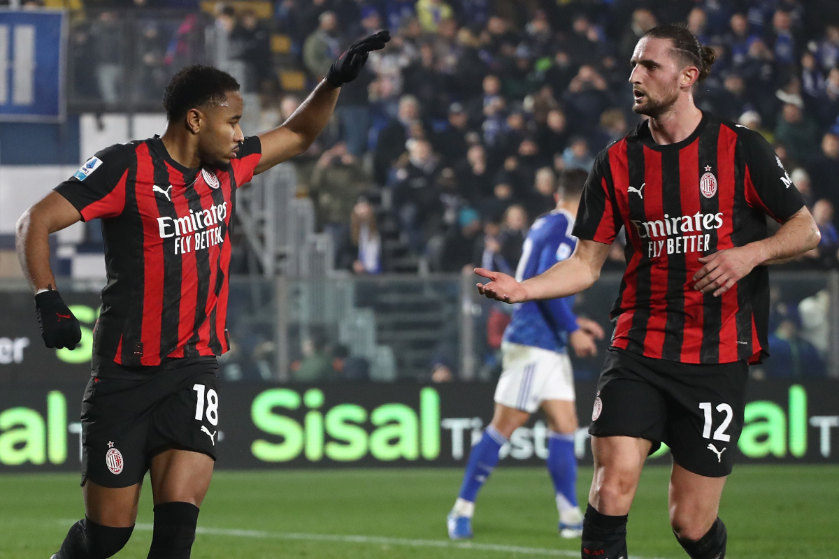 COMO, ITALY - JANUARY 15: Christopher Nkunku of AC Milan celebrates with his team-mate Adrien Rabiot after scoring their team's first goal1 from the penalty spot during the Serie A match between Como 1907 and AC Milan at Giuseppe Sinigaglia Stadium on January 15, 2026 in Como, Italy. (Photo by Marco Luzzani/Getty Images)