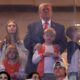Trump gets thunderous reception at Miami vs Indiana college football championship game with Ivanka and granddaughter Kai