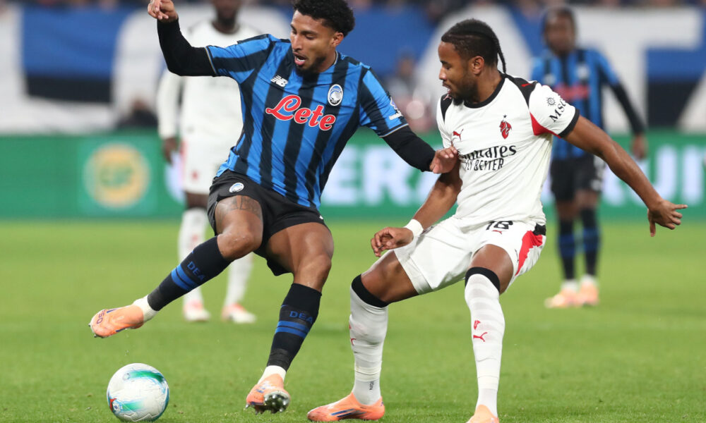 BERGAMO, ITALY - OCTOBER 28: Ederson of Atalanta BC competes for the ball with Christopher Nkunku of AC Milan during the Serie A match between Atalanta BC and AC Milan at New Balance Arena on October 28, 2025 in Bergamo, Italy. (Photo by Marco Luzzani/Getty Images)