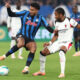 BERGAMO, ITALY - OCTOBER 28: Ederson of Atalanta BC competes for the ball with Christopher Nkunku of AC Milan during the Serie A match between Atalanta BC and AC Milan at New Balance Arena on October 28, 2025 in Bergamo, Italy. (Photo by Marco Luzzani/Getty Images)