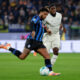 BERGAMO, ITALY - OCTOBER 19: Ederson of Atalanta BC passes the ball under pressure from Nuno Tavares of Lazio during the Serie A match between Atalanta BC and SS Lazio at Gewiss Stadium on October 19, 2025 in Bergamo, Italy. (Photo by Francesco Scaccianoce/Getty Images)