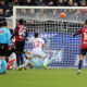 CAGLIARI, ITALY - NOVEMBER 22: Gennaro Borrelli of Cagliari scores his goal 3-2 during the Serie A match between Cagliari Calcio and Genoa CFC at Stadio Sant