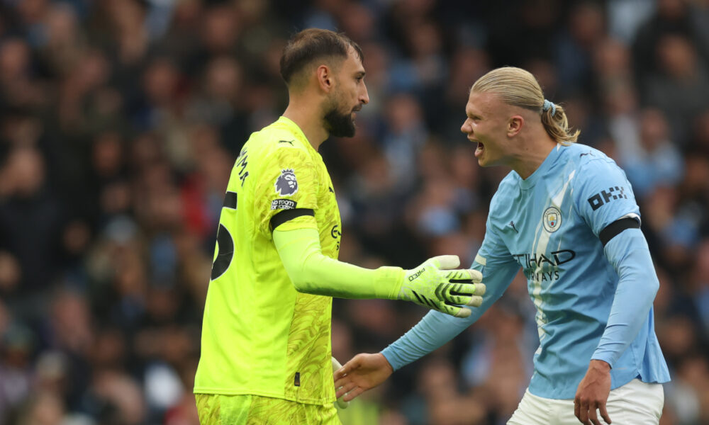 MANCHESTER, ENGLAND - SEPTEMBER 14: Erling Haaland celebrates with Gianluigi Donnarumma of Manchester City and Italy after a save during the Premier League match between Manchester City and Manchester United at Etihad Stadium on September 14, 2025 in Manchester, England. (Photo by Carl Recine/Getty Images)
