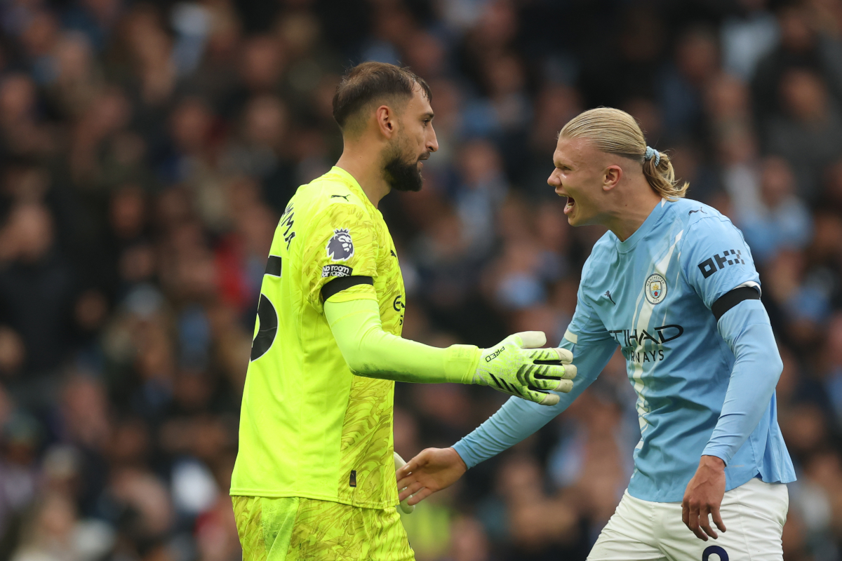 MANCHESTER, ENGLAND - SEPTEMBER 14: Erling Haaland celebrates with Gianluigi Donnarumma of Manchester City and Italy after a save during the Premier League match between Manchester City and Manchester United at Etihad Stadium on September 14, 2025 in Manchester, England. (Photo by Carl Recine/Getty Images)