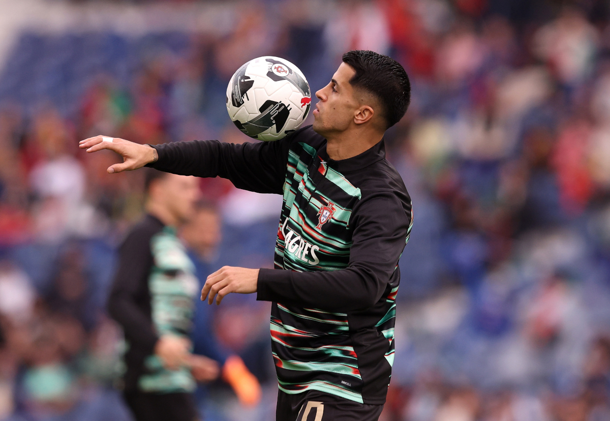 PORTO, PORTUGAL - NOVEMBER 16: Joao Cancelo of Portugal warms up prior to the FIFA World Cup 2026 qualifier match between Portugal and Armenia at Estadio do Dragao on November 16, 2025 in Porto, Portugal. (Photo by Carlos Rodrigues/Getty Images)