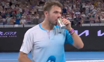 Three-time Grand Slam champion, 40, sinks can of beer on court after heroic battle in last ever Australian Open match