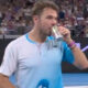 Three-time Grand Slam champion, 40, sinks can of beer on court after heroic battle in last ever Australian Open match