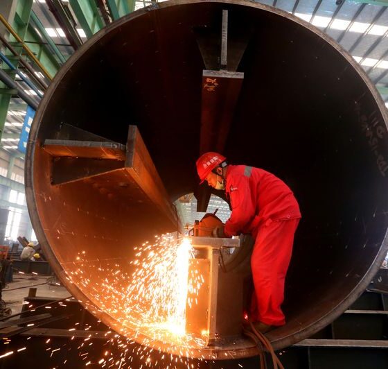 Asia’s factories end 2025 on firmer footing as orders pick up