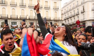 Venezuelan opposition activists in Madrid warily cheer Maduro capture