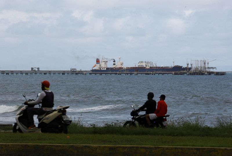 Oil prices slip on ample supply despite political turmoil in Venezuela