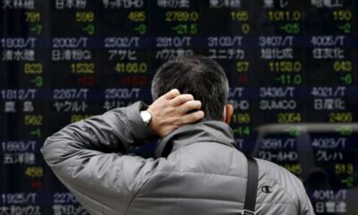 Asian shares shrug off Venezuela impact and climb; oil volatile