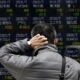 Asian shares shrug off Venezuela impact and climb; oil volatile