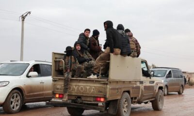 Syrian troops sweep northern towns as Kurdish fighters withdraw