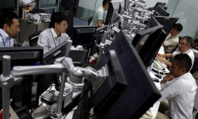 Stocks, dollar take tariff hit; gold gets safety bid