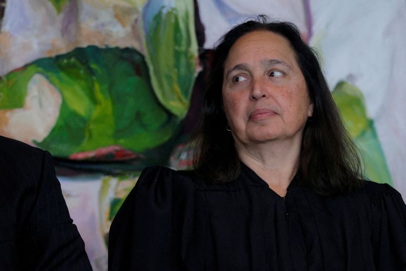 US judge blocks Trump administration’s push to end legal status of 8,400 migrants