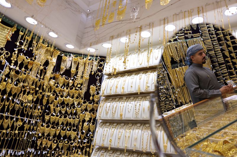 Gold races to $5,100 record peak on frantic safe-haven demand