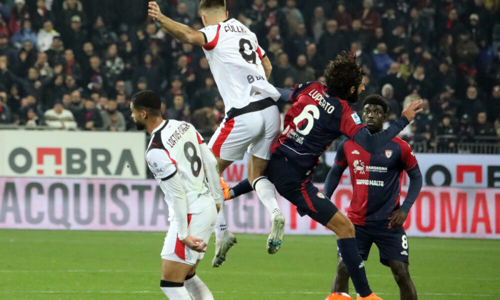 CAGLIARI, ITALY - JANUARY 02: Sebastiano Luperto of Cagliari and Niclas Füllkrug of Milan clash during the Serie A match between Cagliari Calcio and AC Milan at Stadio Sant