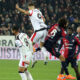CAGLIARI, ITALY - JANUARY 02: Sebastiano Luperto of Cagliari and Niclas Füllkrug of Milan clash during the Serie A match between Cagliari Calcio and AC Milan at Stadio Sant