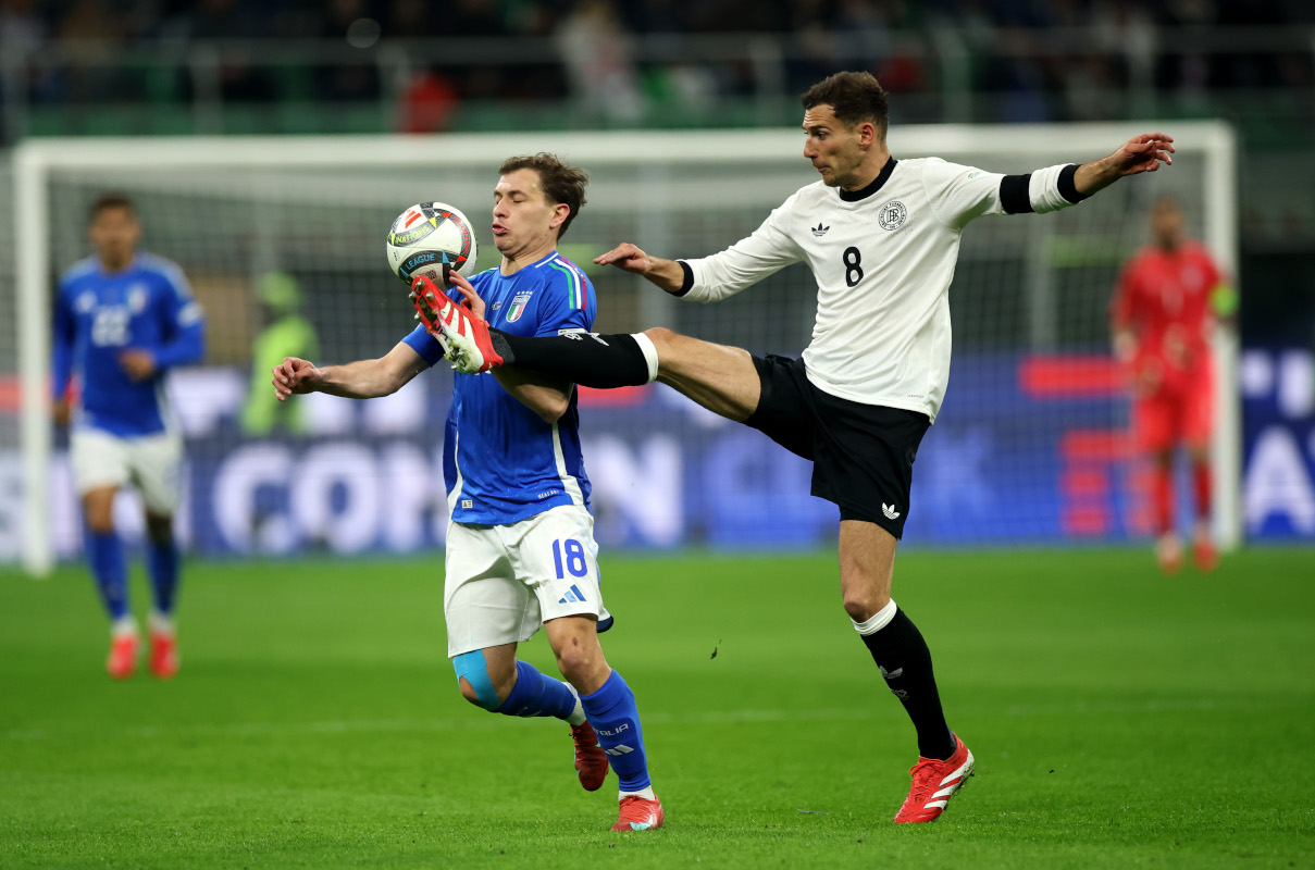 MILAN, ITALY - MARCH 20: Nicolo Barella of Italy battles for possession with Leon Goretzka of Germany during the UEFA Nations League quarterfinal leg one match between Italy and Germany at Stadio San Siro on March 20, 2025 in Milan, Italy. (Photo by Alex Grimm/Getty Images)