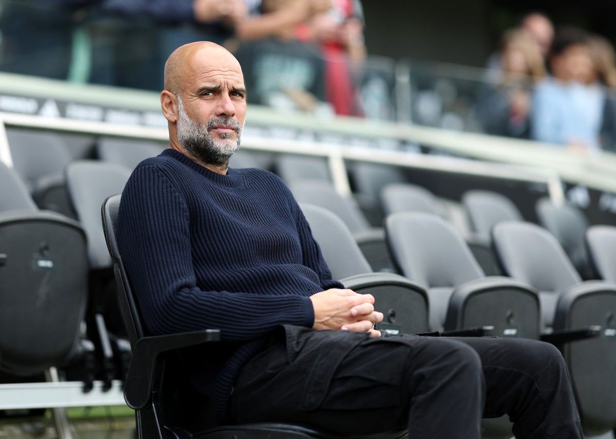 Pep Guardiola looks on ahead of Fulham vs Man City last season