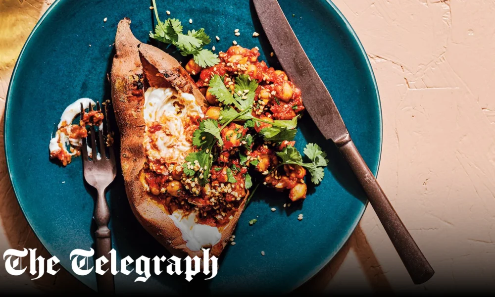 Baked sweet potatoes with harissa chickpeas and tahini sauce