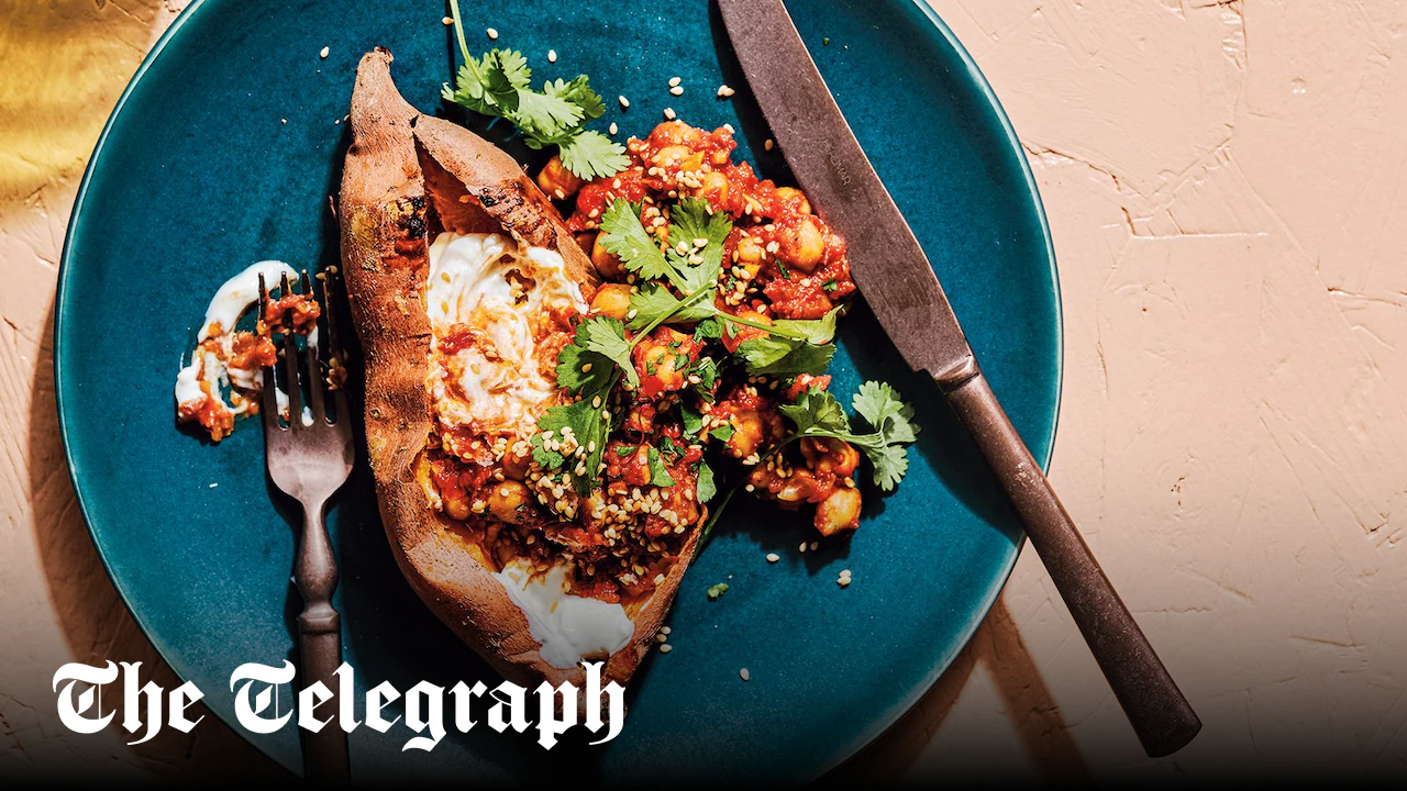 Baked sweet potatoes with harissa chickpeas and tahini sauce