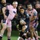 Keelan Giles of Ospreys has the ball surrounded by Cardiff players