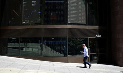 Aussie shares end rocky week slightly lower, gold soars
