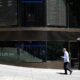 Aussie shares end rocky week slightly lower, gold soars