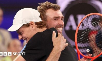 Amateur player Jordan Smith hugs Australian Open champion Jannik Sinner after beating him in the One Point Slam
