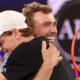 Amateur player Jordan Smith hugs Australian Open champion Jannik Sinner after beating him in the One Point Slam