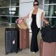 christine andrew airport outfit with beis luggage