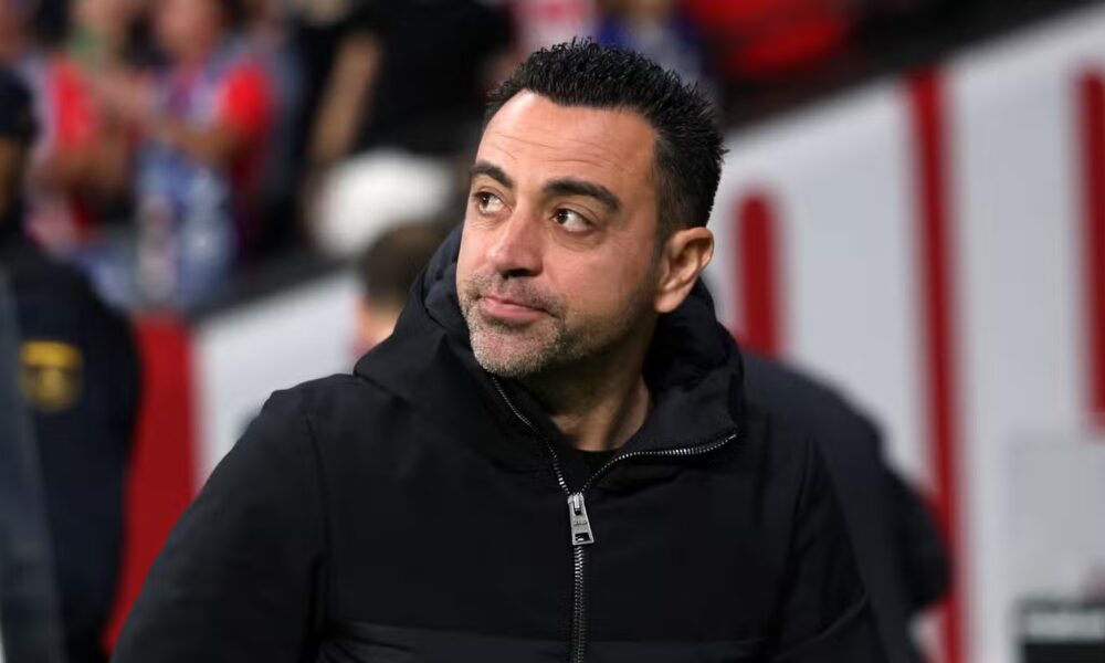 Barcelona head coach Xavi looks on from the touchline