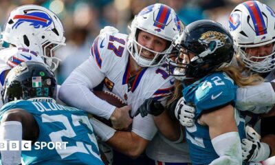 Buffalo Bills quarterback Josh Allen is tackled against the Jacksonville Jaguars