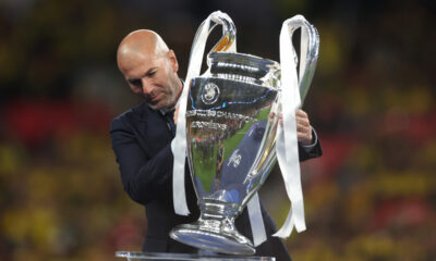 LONDON, ENGLAND - JUNE 01:Former Real Madrid and Juventus star Zinedine Zidane places the Champions League Trophy onto the plinth after the UEFA Champions League 2023/24 Final match between Borussia Dortmund and Real Madrid CF at Wembley Stadium on June 01, 2024 in London, England. (Photo by Lars Baron/Getty Images)