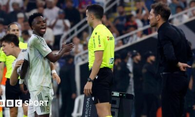 Real Madrid winger Vinicius Jr is substituted against Atletico Madrid, whose manager Diego Simeone watches from the touchline