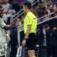 Real Madrid winger Vinicius Jr is substituted against Atletico Madrid, whose manager Diego Simeone watches from the touchline