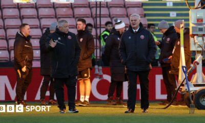 Sheffield United groundstaff inspect the pitch